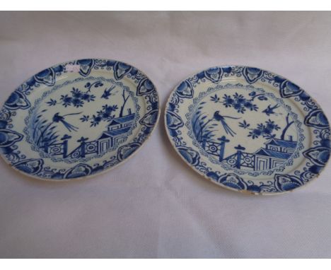 Pair of Early Delft Blue & White Tin Glaze plates in Chinese style depicting Cherry Blossom, Birds and a building, with flora