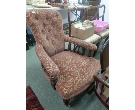 Upholstered floral Elbow chair with button back upholstery, Mahogany Framed with spindle supports and Turned caster feet