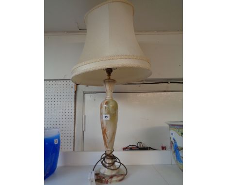 Large Onyx turned table lamp with brass fitting and cream shade 