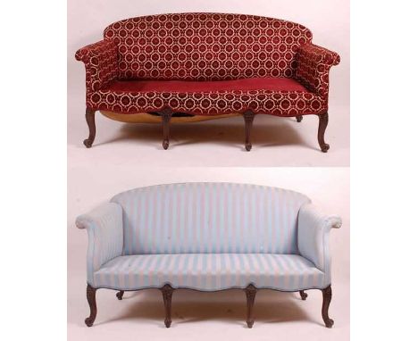 A near-pair of Victorian mahogany framed settees, each with raised backs and scroll arms, one later upholstered in striped bl