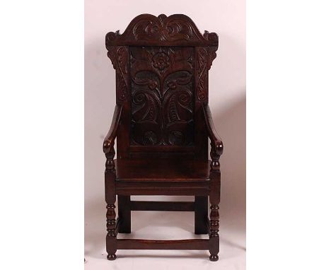 A child's joined oak Wainscott chair, in the 17th century style, probably Victorian but recently restored, having blind carve