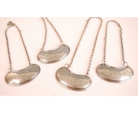 A set of four Edwardian silver decanter collars, annotated for Sherry, Whisky, Brandy, and Gin, 1.3oz, maker Atkin Brothers, 