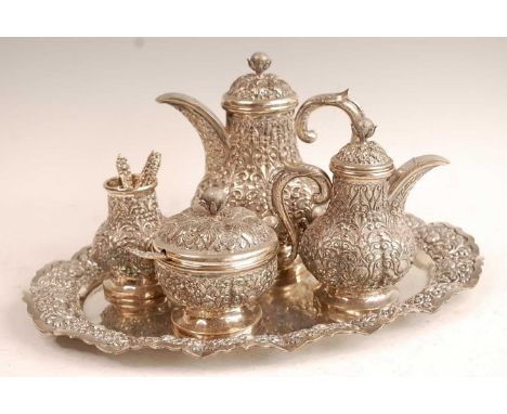 An Indonesian Yogya white metal four-piece coffee service on tray,  the tray with presentation inscription dated 1977, compri