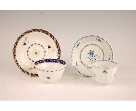 An 18th century Worcester tea bowl on stand, each being spiral fluted and with blue banded and gilt decoration, crescent C ma