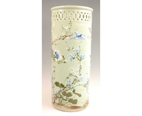 A Japanese celadon glazed stoneware stick / umbrella stand, of cylindrical form with pierced frieze, the whole decorated in r