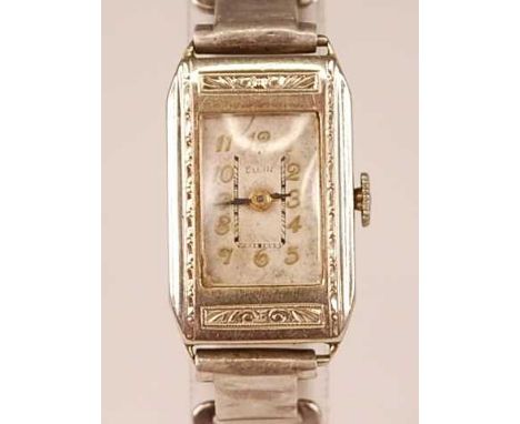 An Elgin lady's 14ct white gold cased manual wind wristwatch, having a signed tank dial and raised and gilded Roman numerals,