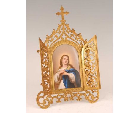 A 19th century continental cut brass easel frame, having twin hinged doors opening to reveal half-length painted porcelain po