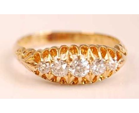 An Edwardian 18ct yellow gold diamond five-stone half hoop eternity ring, featuring five graduated Old European cut diamonds 