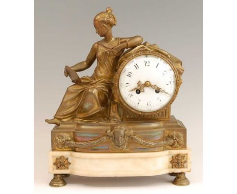 A 19th century gilt brass mantel clock, having an unsigned convex white enamel dial, twin winding holes for an eight-day Fren