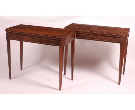 A pair of Regency rosewood D-shaped card tables, each with fold-over tops opening to reveal baize lined playing surfaces, on 
