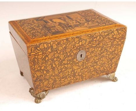 A Regency satinwood and penwork tea caddy, the hinged cover decorated with an interior family scene within a border of fruiti