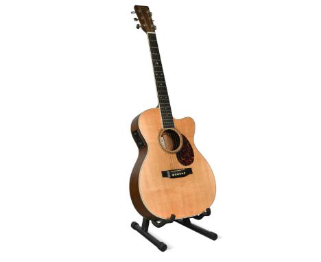 A Martin &amp; Co. OMC-16OGTE acoustic six-string guitar, the three-piece back with ovangkol wings and an Indian rosewood wed