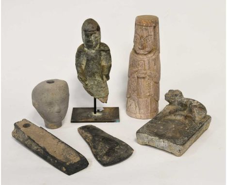Five Chinese miscellaneous stone items, including a part standing figure of a guardian23.5cm high;two axe heads;a Chinese gre