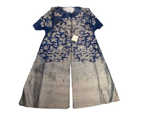 A Chinese Mandarin's blue and silver summer dragon robe, circa 1930, worked with numerous sky dragons over waves and earth 12