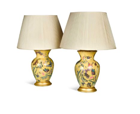 A pair of enamelled baluster table lamps, modern, each with yellow ground decorated with butterflies and foliage with pleated