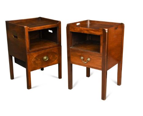 A near pair of George III mahogany night cupboards, both with tray tops above an open recess and drawer below and raised on s