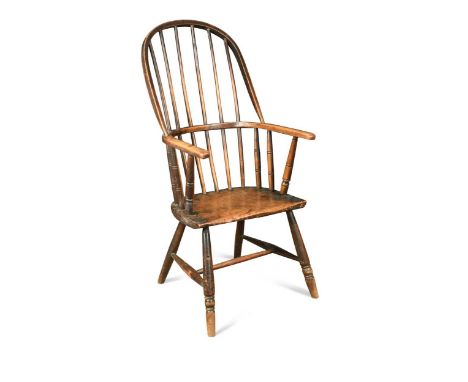 An ash stick back armchair, 19th century, the hooped stick back over a solid wood seat raised on turned legs and H-frame stre