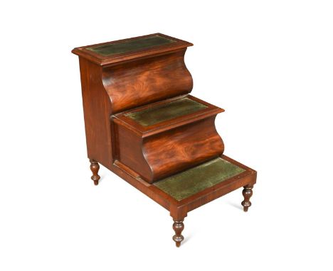 A Victorian mahogany three step commode, each step with green leather inset, the top step hinged to reveal a plain compartmen