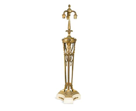An Empire style gilt metal and onyx lamp, late 19th century, with three branches above three uprights with ram's head termina