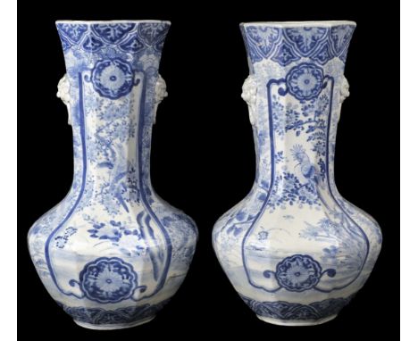 * Vases. A pair of 20th century Chinese blue and white porcelain vases, of octagonal form with long slender neck, decorated w