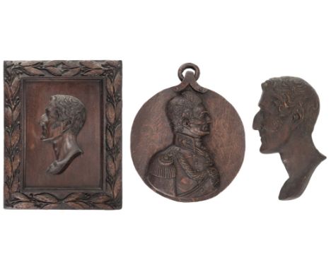 * Duke Of Wellington. A Regency period carved oak panel of the Duke of Wellington, circa 1820, the duke facing left, with car