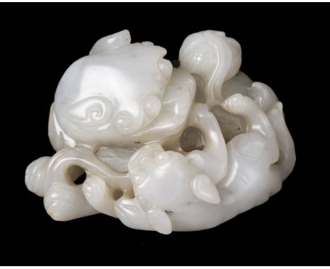 * Jade. A Chinese jade carving of a lion and cub, carved in a playful manor with a ball, 7 cm longQTY: (1)
