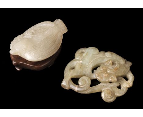 * Jade. A Chinese jade pebble, carved as a bird with a branch in its beak, carved wings, tail and claws, 6 cm long, presented
