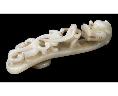 * Jade. A Chinese jade belt hook, carved as a dragon, 10 cm longQTY: (1)