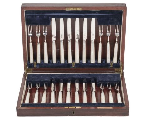 * Canteen. A set of silver tea knives and forks by Edward &amp; Sons, Sheffield 1929, comprising 12 knives and 12 forks each 