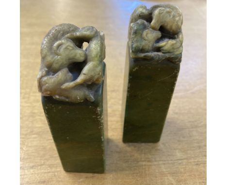 * Seals. A pair of early 20th century soapstone wax seals, green and brown veined stone, the tops carved with three rams, one