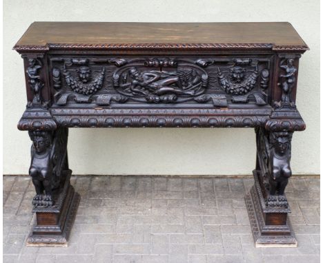* Marriage Chest. A 17th century walnut cassone, the gadrooned top above a panel carved with a river god, scrolls, festoons, 