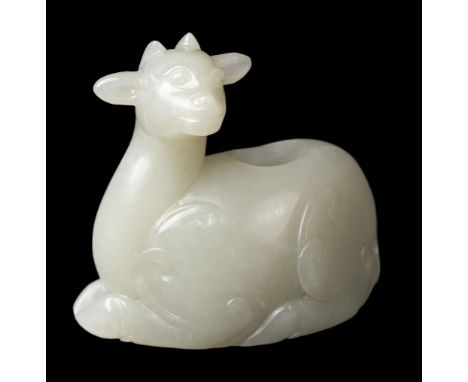 * Jade. A Chinese jade brush washer, carved as a recumbent goat, 7.5 cm longQTY: (1)