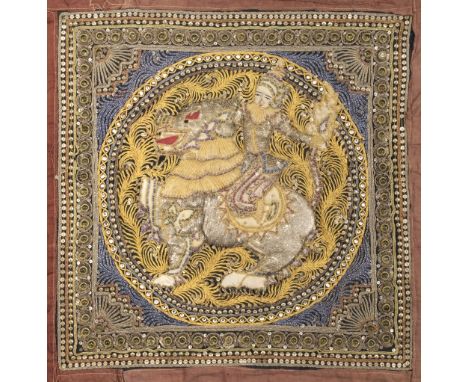 * Burma. An embroidered Kalaga panel, early 20th century, elaborately embroidered in relief with metallised and coloured thre