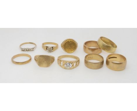 Five 9ct and yellow metal wedding bands, an Isle of Man 1989 Angel 1/20th fine gold coin in a 9ct ring mount and four further