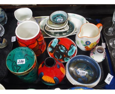 A collection of Poole pottery including a John Adams design cucumber dish, Cromarty pottery dishes by Alastair Dunn, Portmeir