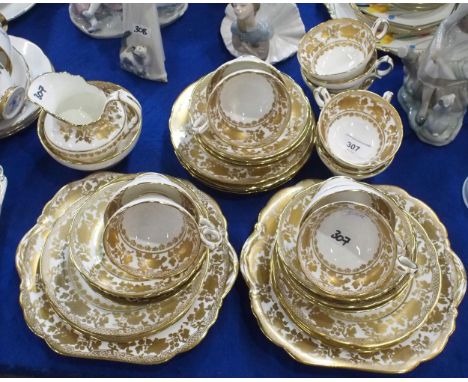 A Hammersley and Co teaset comprising twelve cups, saucers, plates, two cake plates, milk jug and sugar bowl, pattern number 