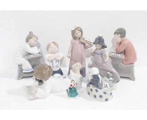 Seven Nao figures of children, a pair of children sat at desks, together with a miniature Doulton figure Condition Report:Ava