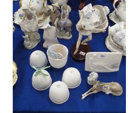 A Lladro figure of a ballerina, four other figures, four bells, a night light and two Lladro Society stands Condition Report: