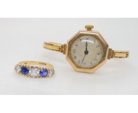 A 9ct gold cased ladies watch, together with a clear and blue gem set traditional scroll ring, size Q1/2, weight together wit