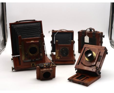 A mahogany and brass bellows plate field camera with Ross, London lens; a Thornton Pickard example, lacking lens; and various