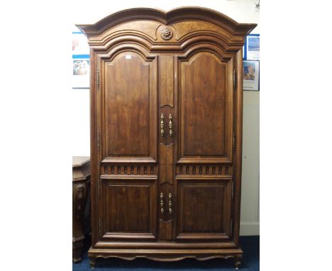 A Modern Karges of Grand Rapids Michigan reproduction linen press with shaped cornice over pair of panel doors concealing ope