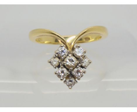 An unusual 18ct gold diamond cluster ring, size P1/2, set with estimated approx 0.50cts of brilliant cut diamonds. Weight 5.3