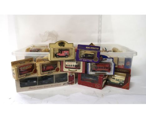 A collection of boxed diecast scale model vehicles, including Lledo Models of Days Gone, Matchbox Models of Yesteryear and Ox