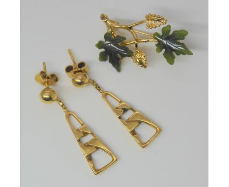A pair of 9ct gold earrings, weight 3.9gms and a gold plated New Zealand jade brooch&nbsp; Condition Report:Available upon re