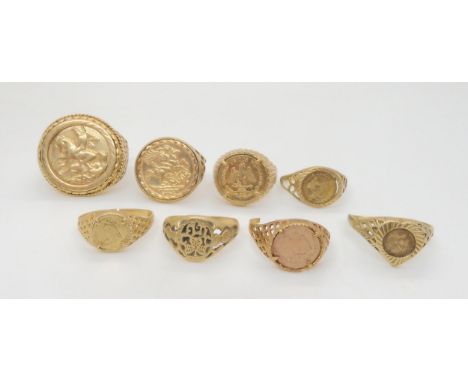 Seven 9ct gold faux coin rings, and a Celtic ring, weight all together 25.1gms Condition Report:Available upon request