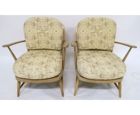 A pair of mid 20th century elm and beech Ercol 334 easy chairs, 81cm high x 68cm wide x 69cm deep (2) Condition Report:Availa