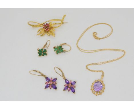 A 9ct gold red gem brooch, 9ct emerald earrings, amethyst pendant and chain and earrings. Weight 11.8gms Condition Report:Ava