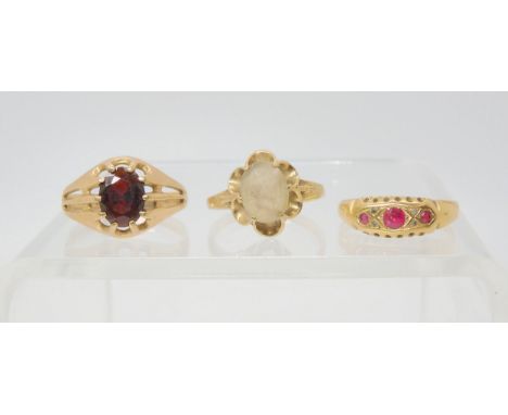 An 18ct gold red gem and diamond accent ring, size P1/2, weight 1.6gms, a 9ct gold garnet ring size S, and a smoky quartz rin