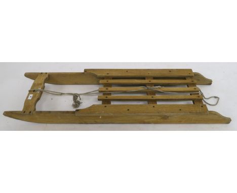 A 20th century Murray &amp; Baldwin Ltd sled, 131cm long x 36cm wide Condition Report:Available upon request