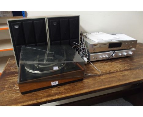 A Garrard vinyl record player turntable together with two Amstrad Acousta 1500 8 ohms speakers and a Rotel RA-04 amplifier an